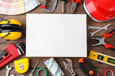 Flat lay composition with construction tools on wooden background. Space for text