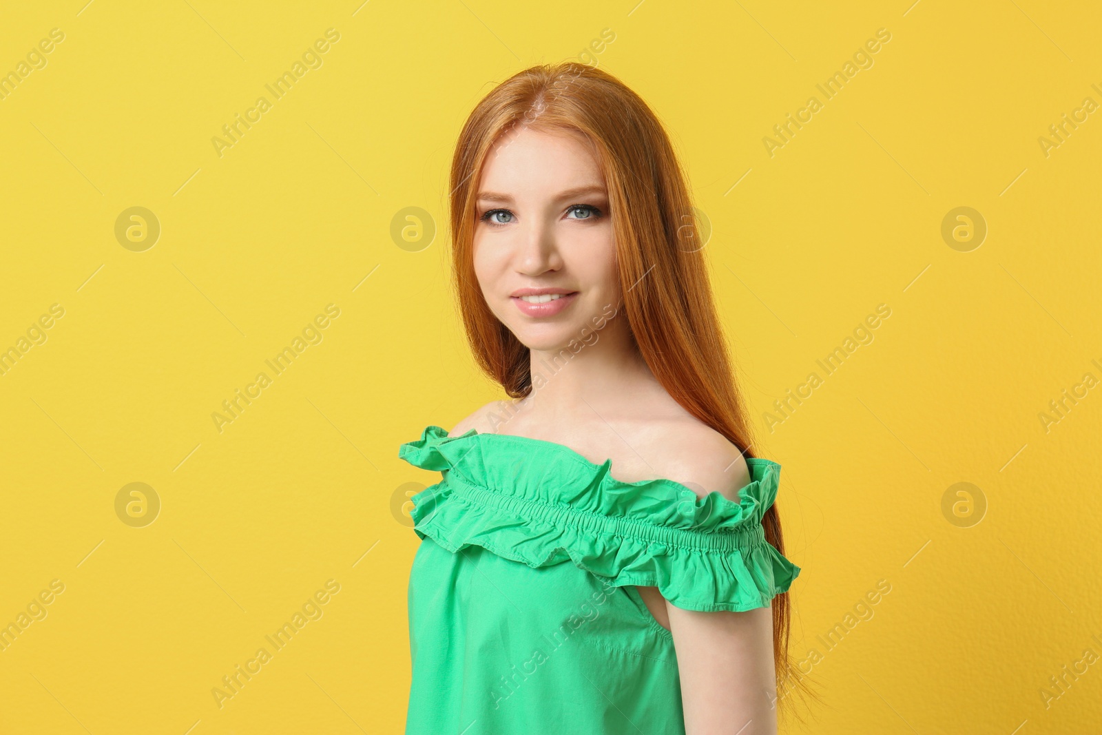 Photo of Portrait of young model with beautiful  hair on color background