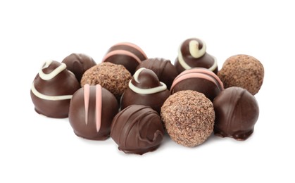 Many different delicious chocolate truffles on white background