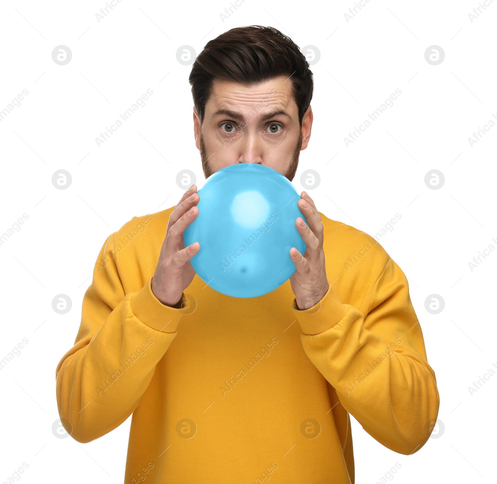 Photo of Man inflating light blue balloon on white background