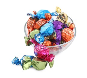 Bowl with sweet candies in colorful wrappers on white background