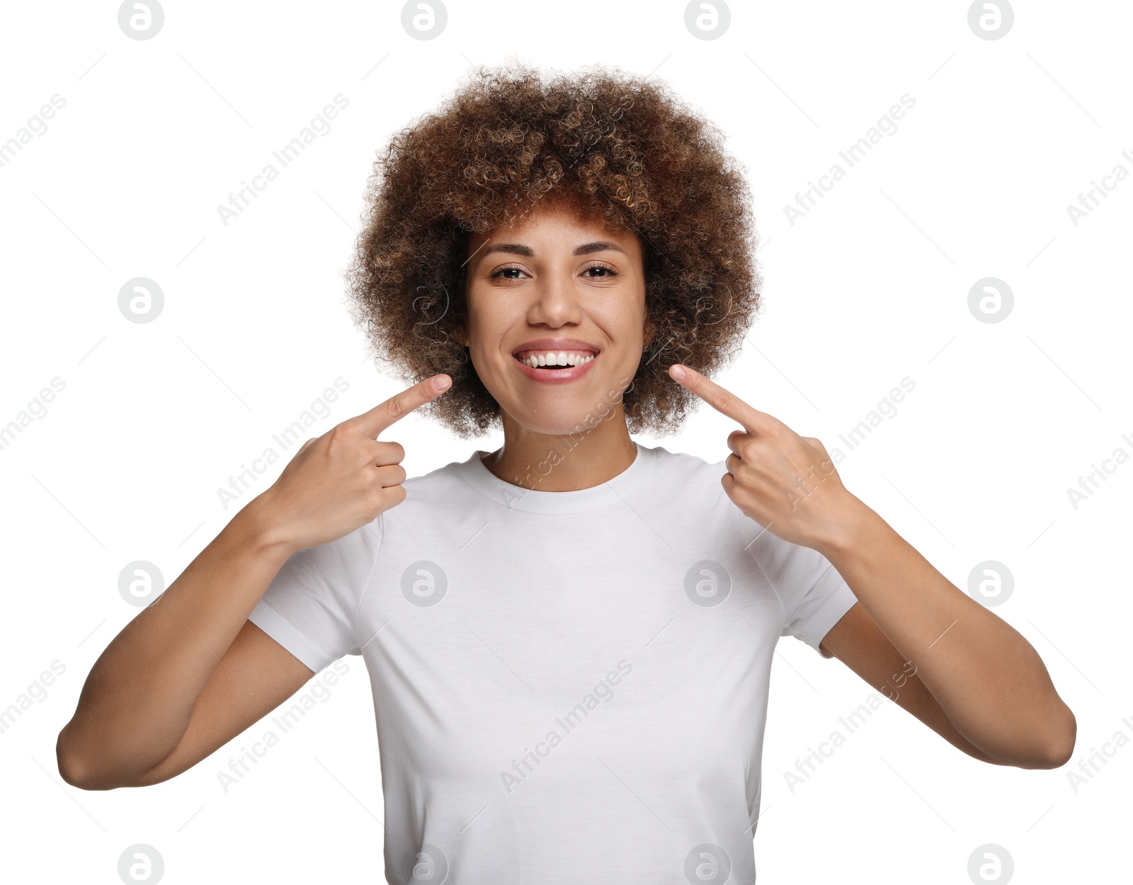 Photo of Woman showing her clean teeth and smiling on white background