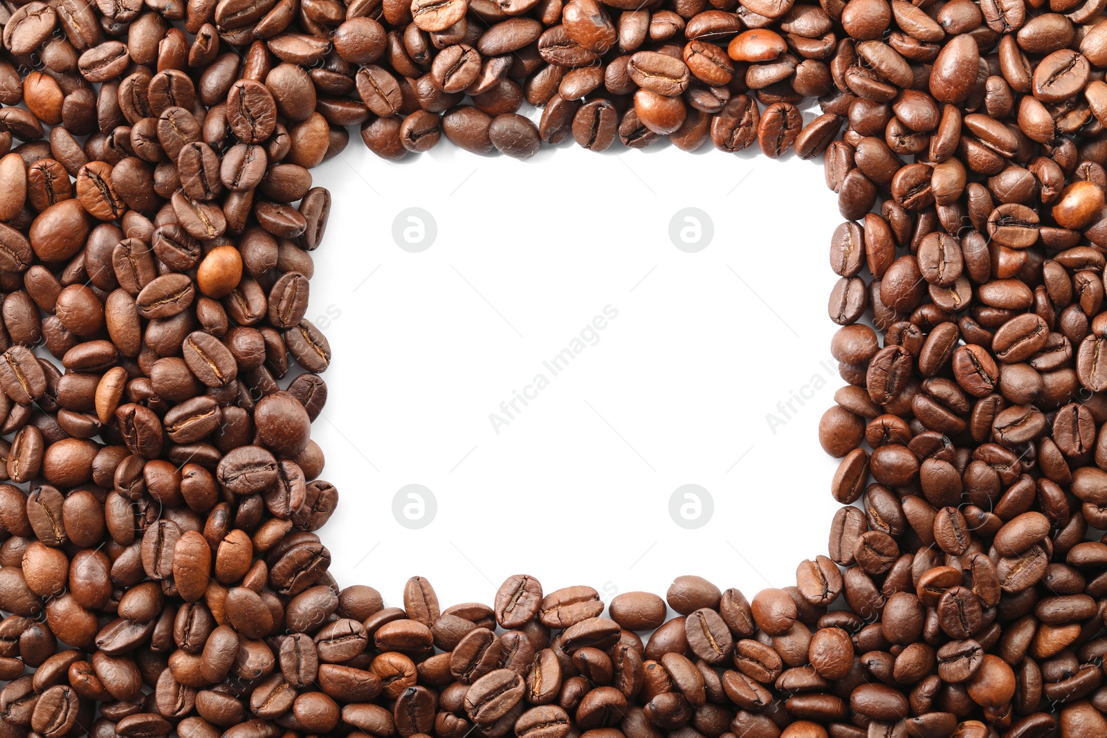 Photo of Frame of roasted coffee beans on white background, top view