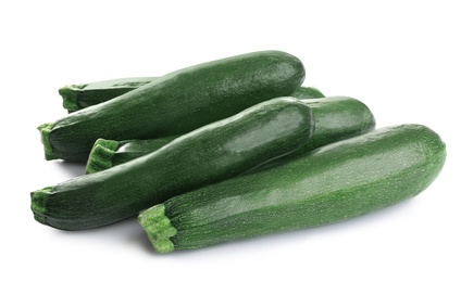 Fresh ripe green zucchinis isolated on white