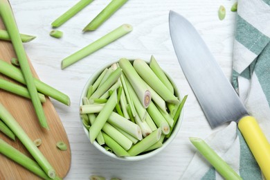 Photo of Flat lay composition with fresh lemongrass stalks on white wooden table