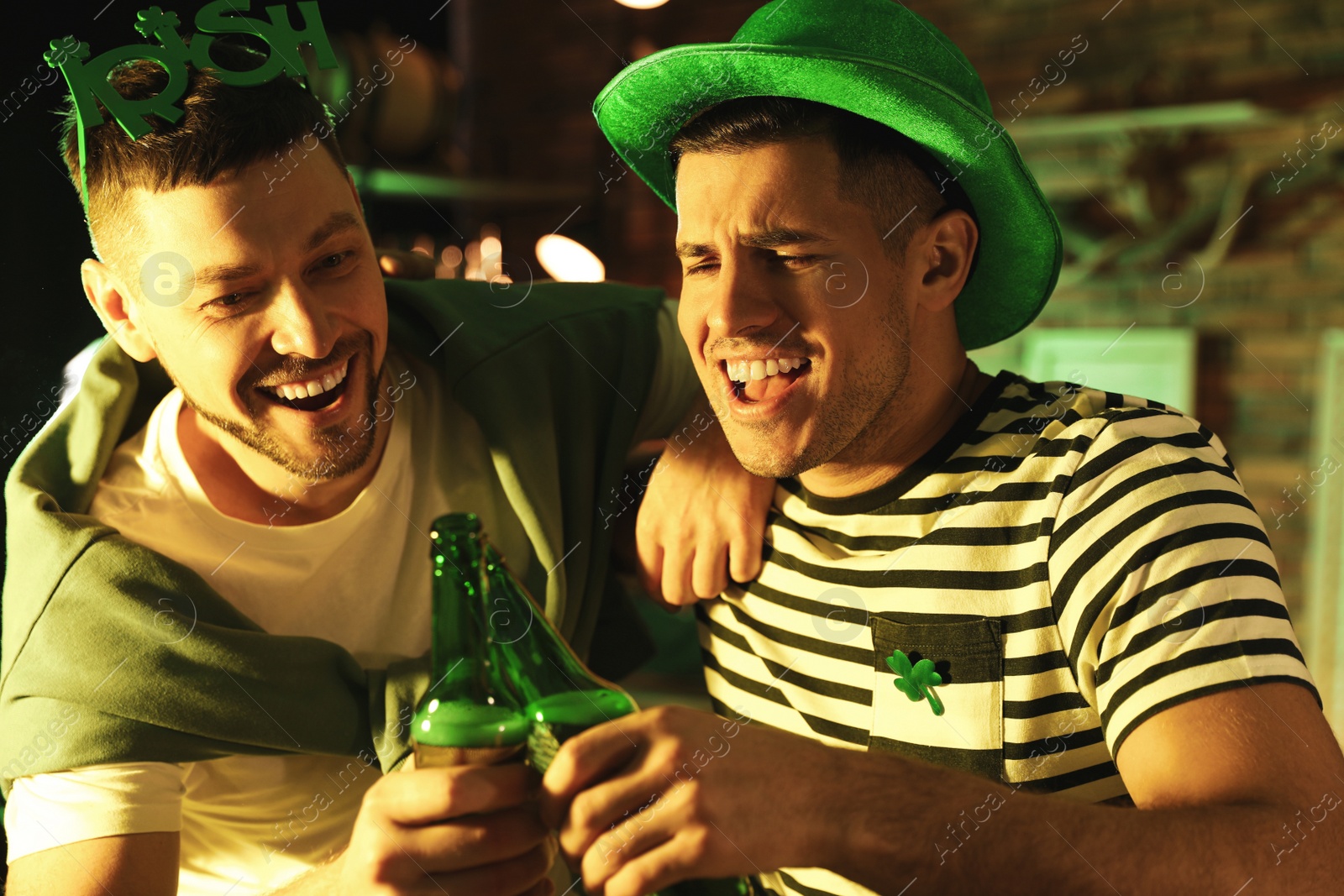 Photo of Men with beer celebrating St Patrick's day in pub