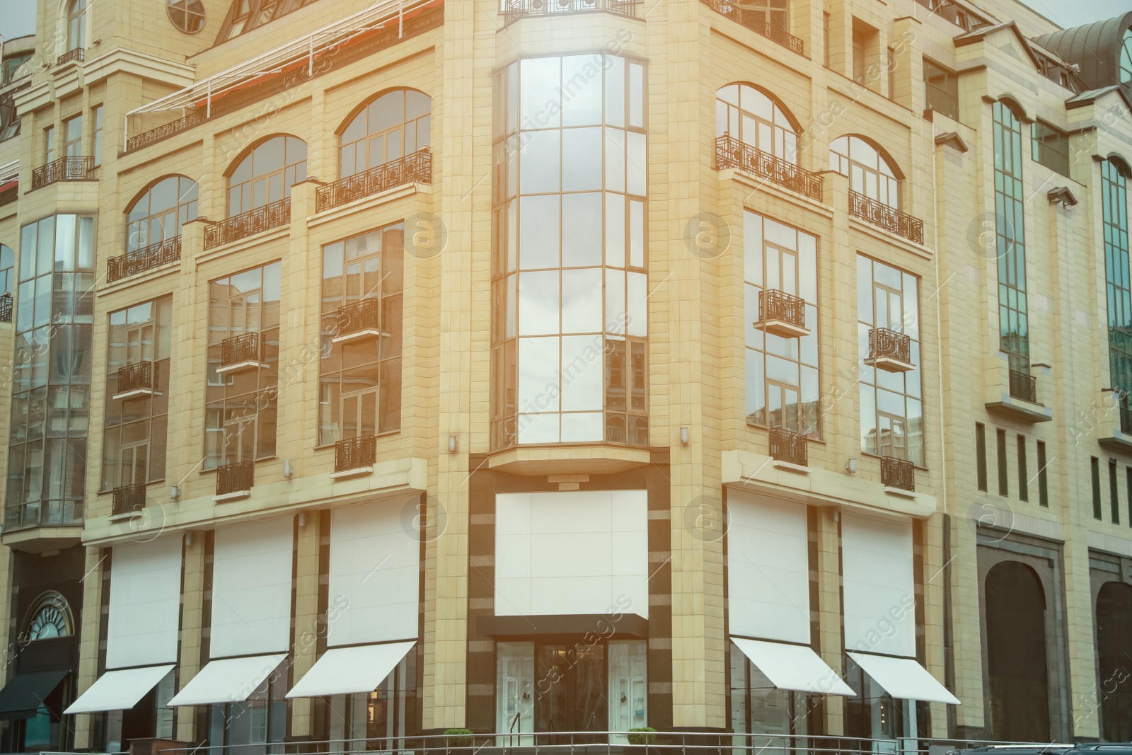 Photo of Building exterior with blank advertising boards. Mockup for design