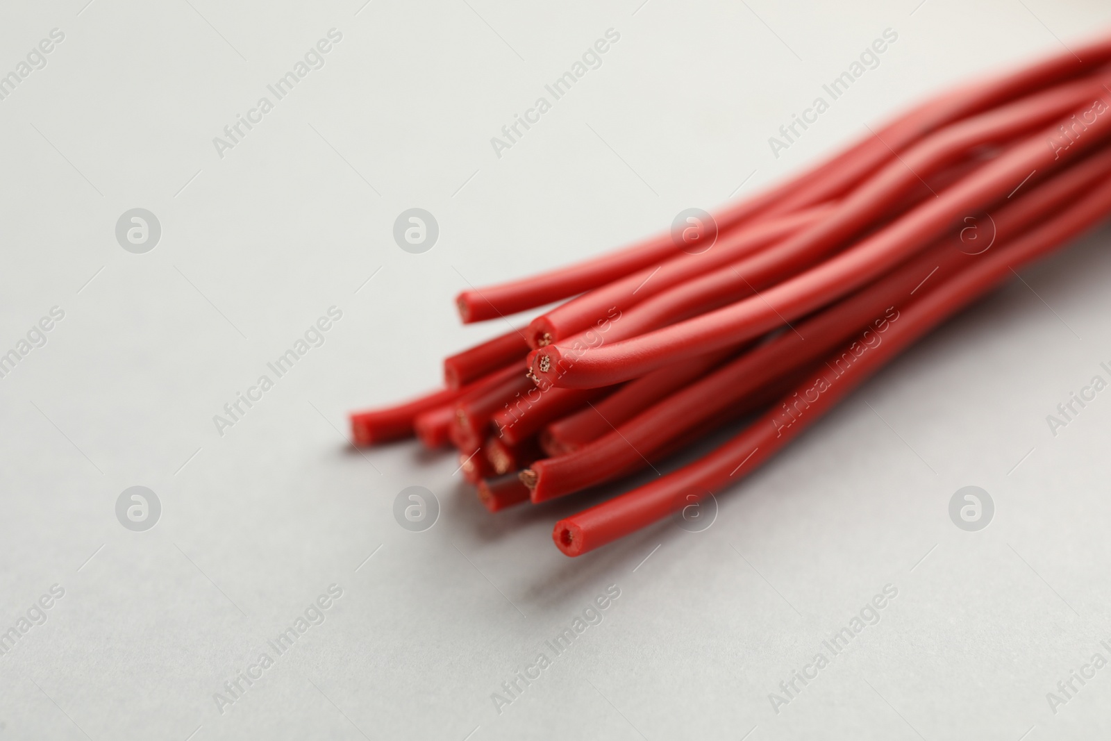 Photo of Closeup view of electrical power cables on white background