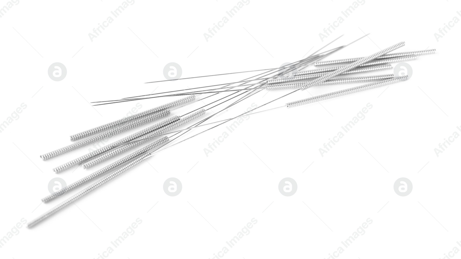 Photo of Many needles for acupuncture on white background