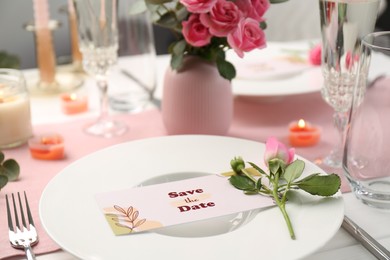 Romantic table setting with flowers and candles