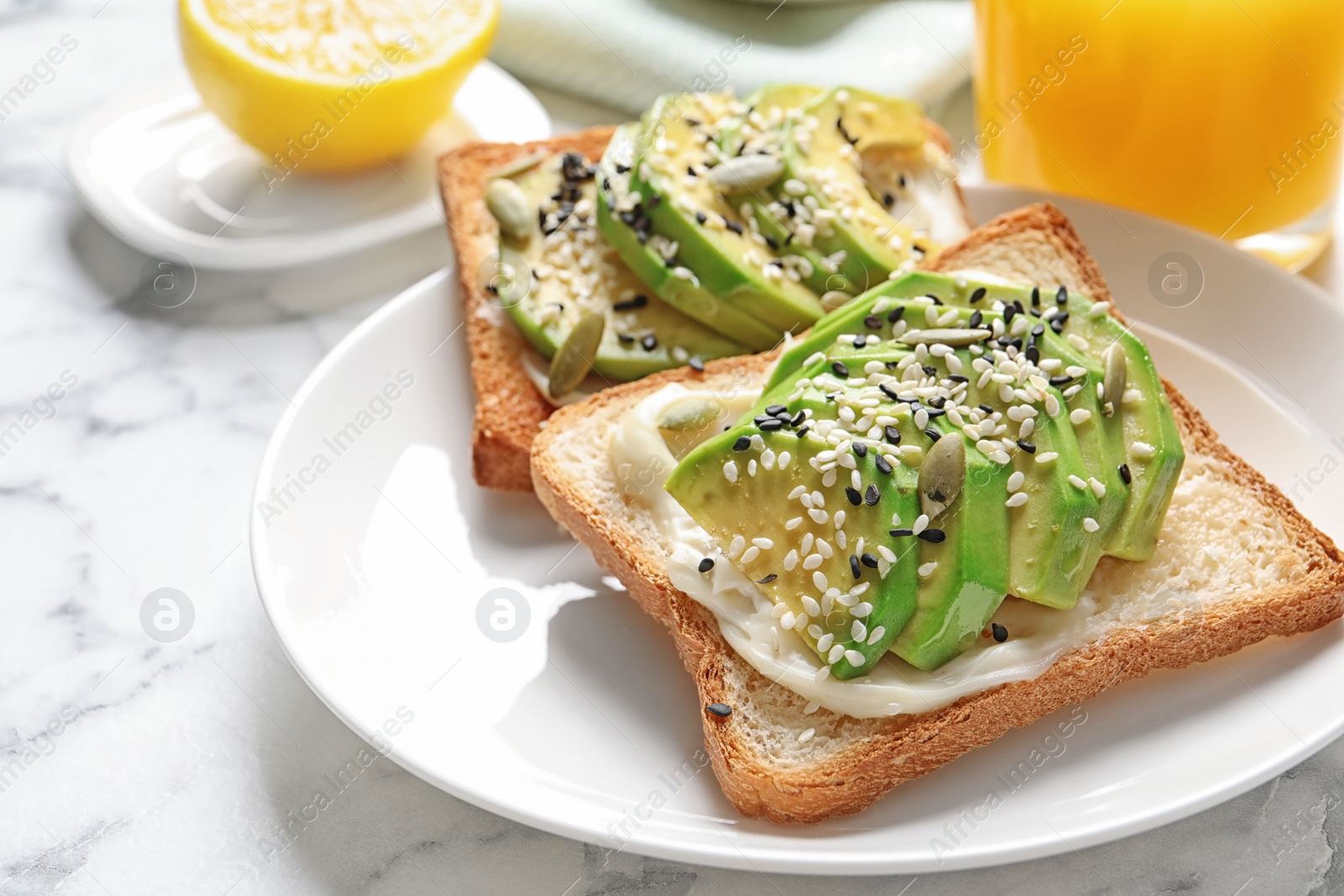 Photo of Toast bread with avocado and seeds on plate