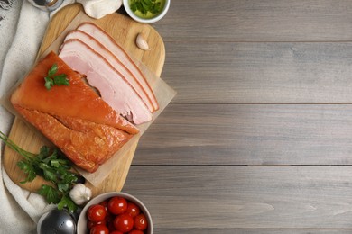 Photo of Flat lay composition with delicious smoked bacon on wooden table, space for text