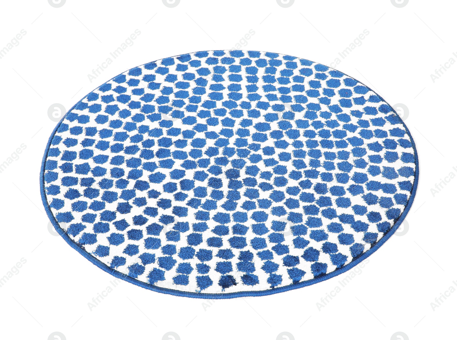 Photo of Round spotted carpet on white background