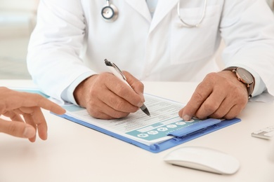 Photo of Man with health problems visiting urologist at hospital