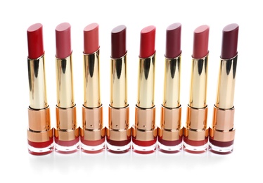 Photo of Many different stylish lipsticks on white background