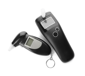Different modern breathalyzers on white background, top view