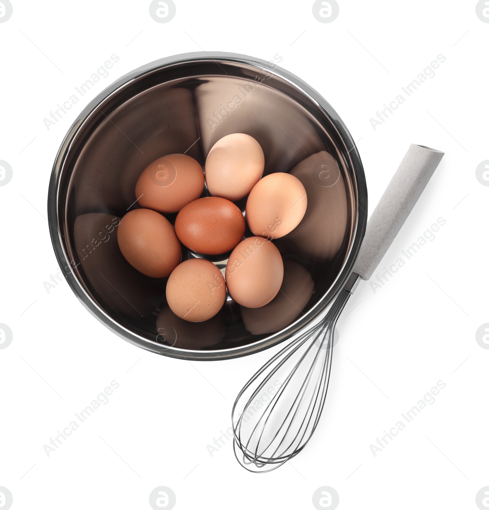 Photo of Metal whisk and raw eggs in bowl isolated on white, top view