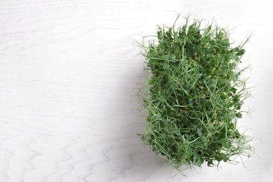 Fresh organic microgreen on white background, top view. Space for text