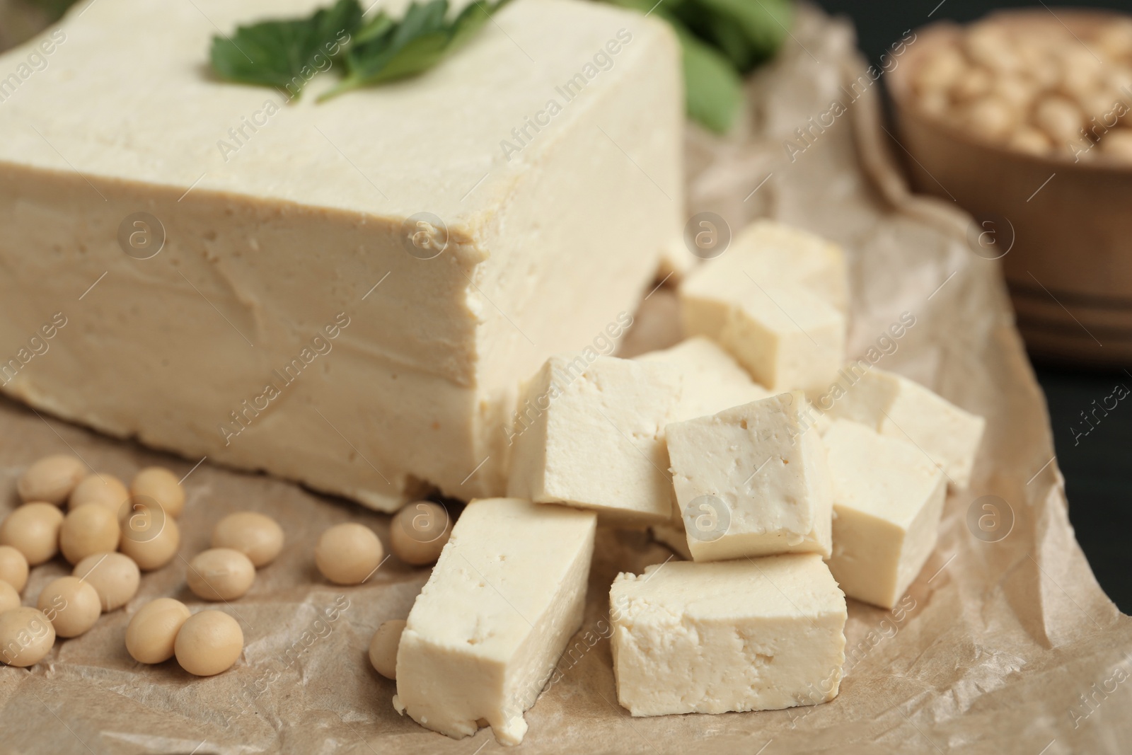 Photo of Delicious tofu and soy on table, closeup