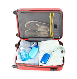 Photo of Packed suitcase with deodorant and clothes on white background