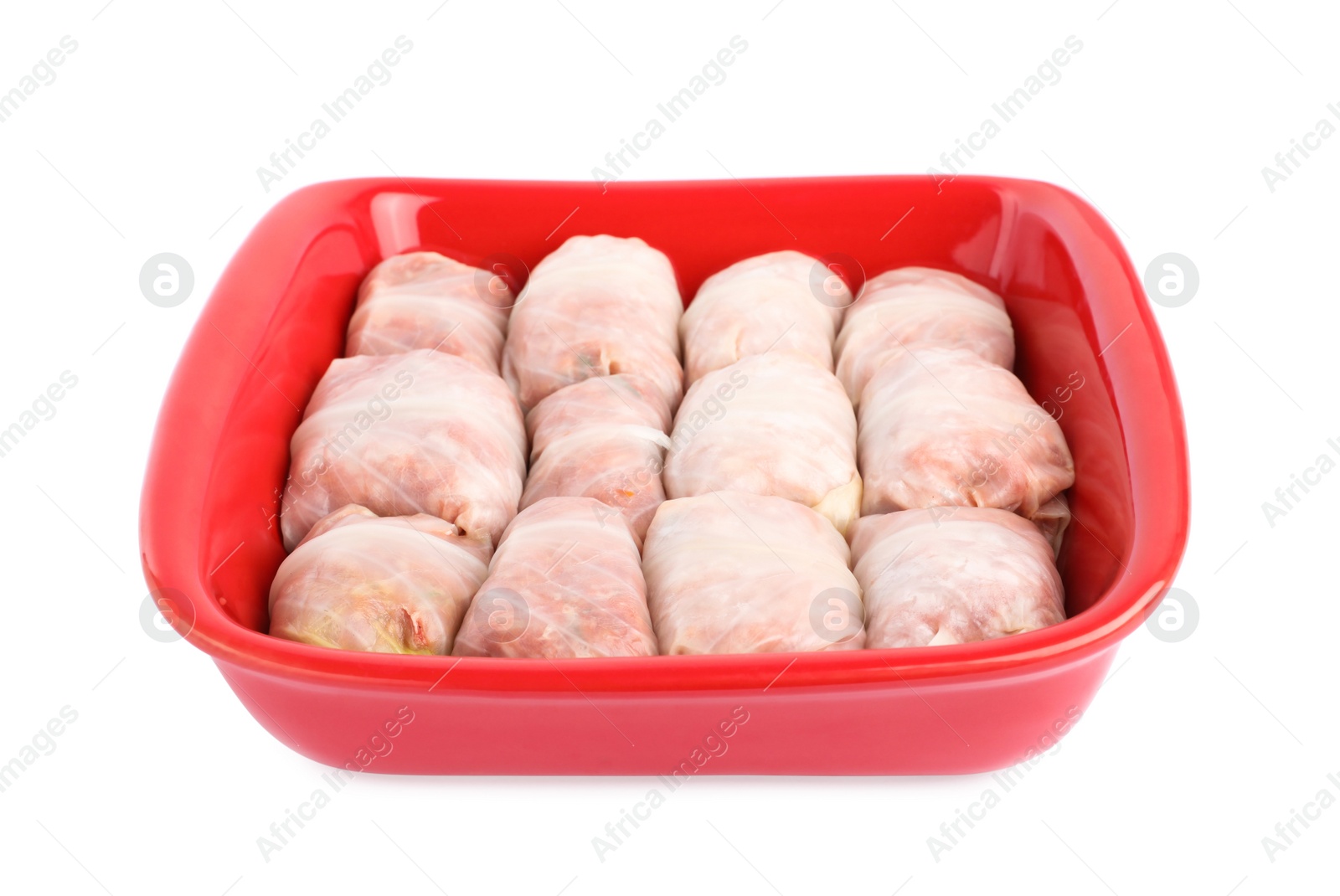 Photo of Stuffed cabbage rolls in baking dish isolated on white