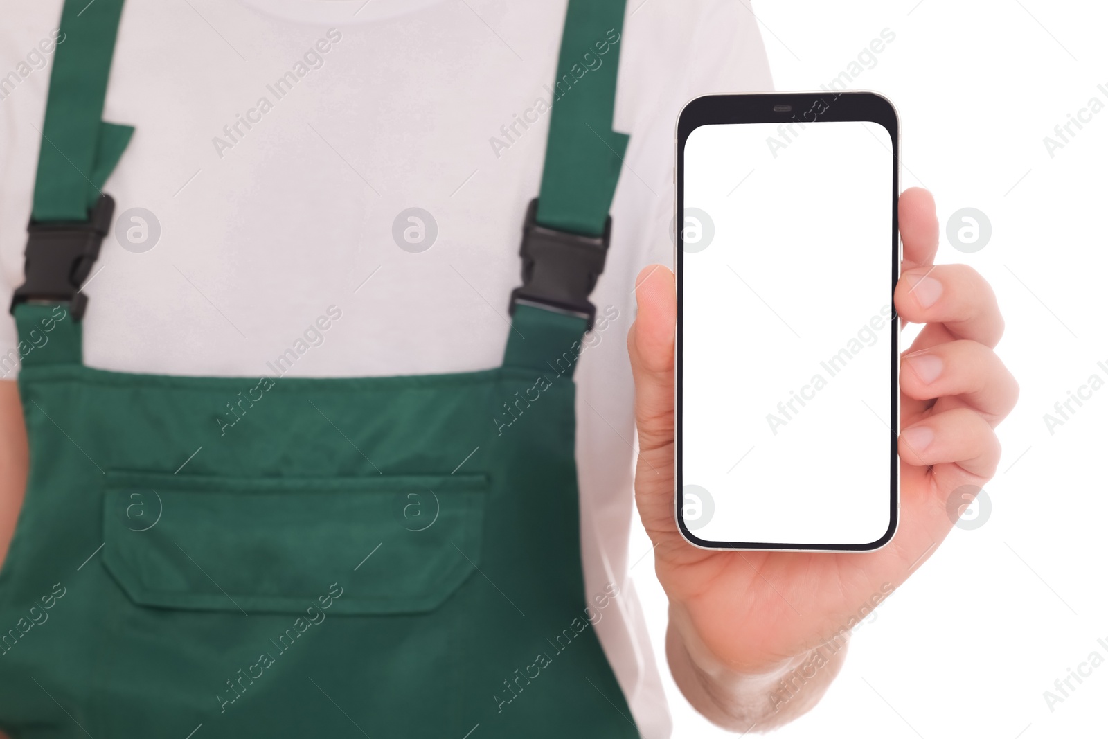 Photo of Professional repairman in uniform with phone on white background, closeup