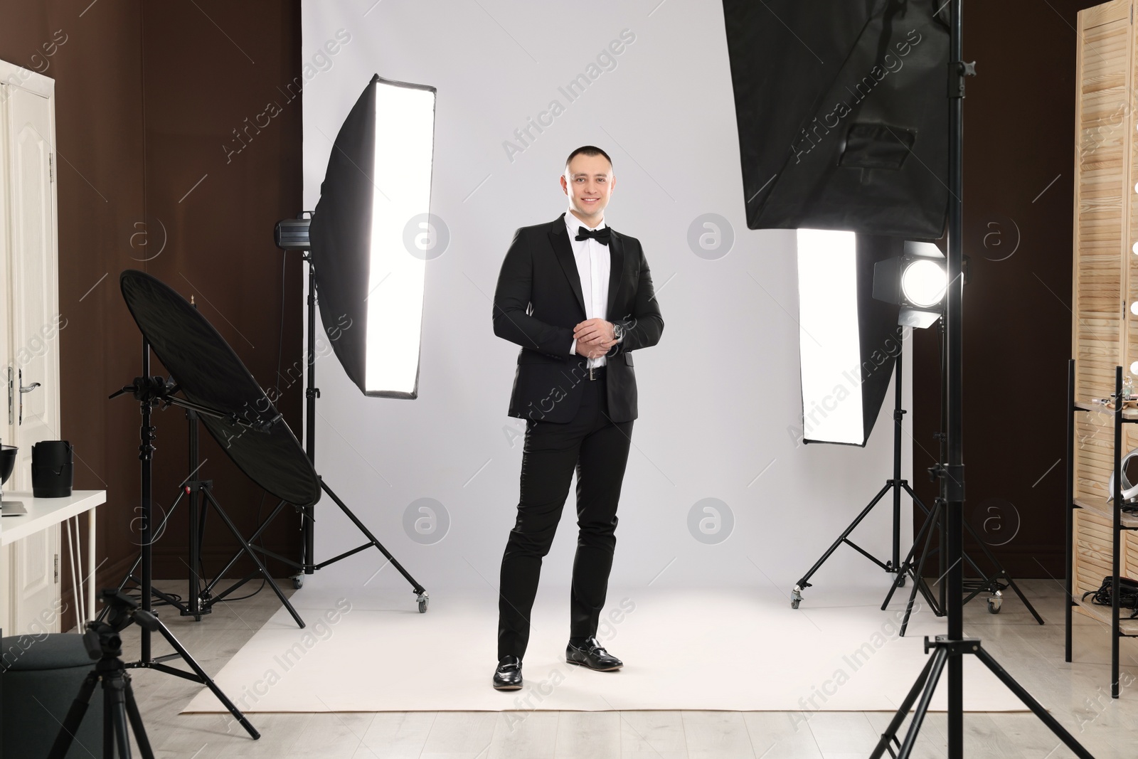 Photo of Handsome model posing in studio. Professional photo session