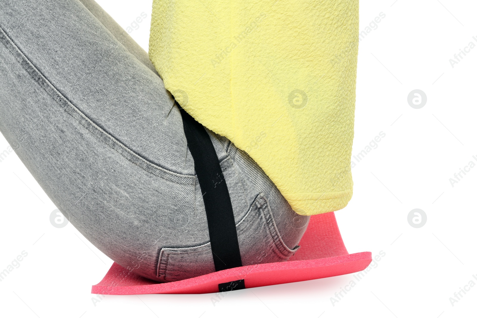 Photo of Woman sitting on foam tourist mat against white background, closeup