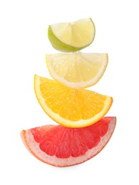 Photo of Cut fresh citrus fruits isolated on white