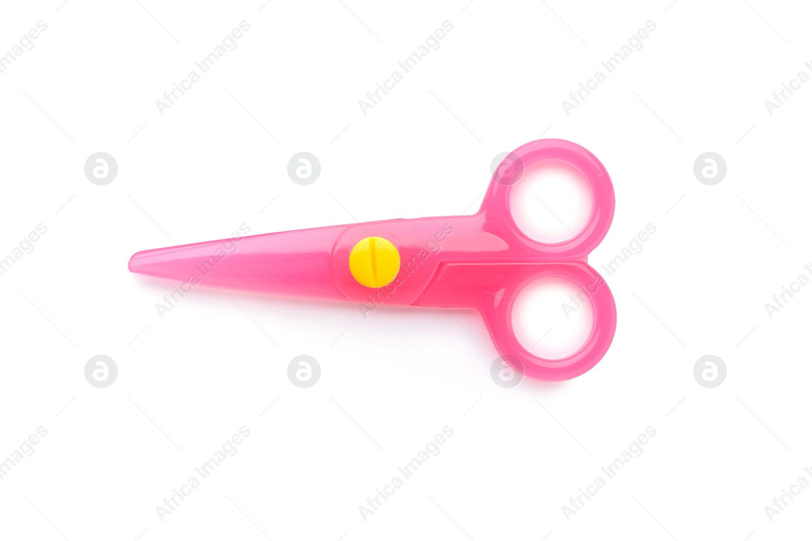 Photo of Pink plastic scissors on white background. Stationery for school