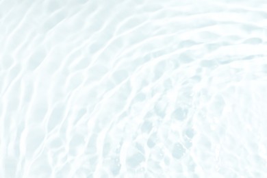 Closeup view of water with ripples on white background