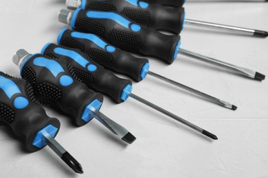 Set of screwdrivers on light grey background, closeup