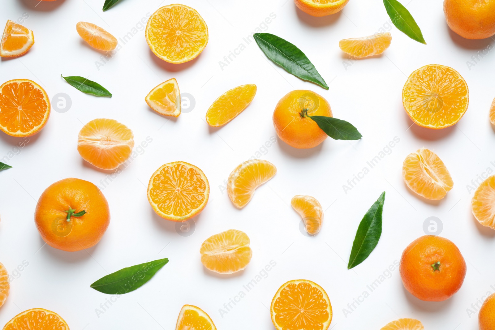 Photo of Composition with fresh ripe tangerines and leaves on white background, flat lay. Citrus fruit
