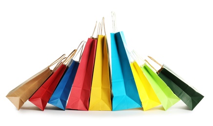 Colorful paper shopping bags on white background