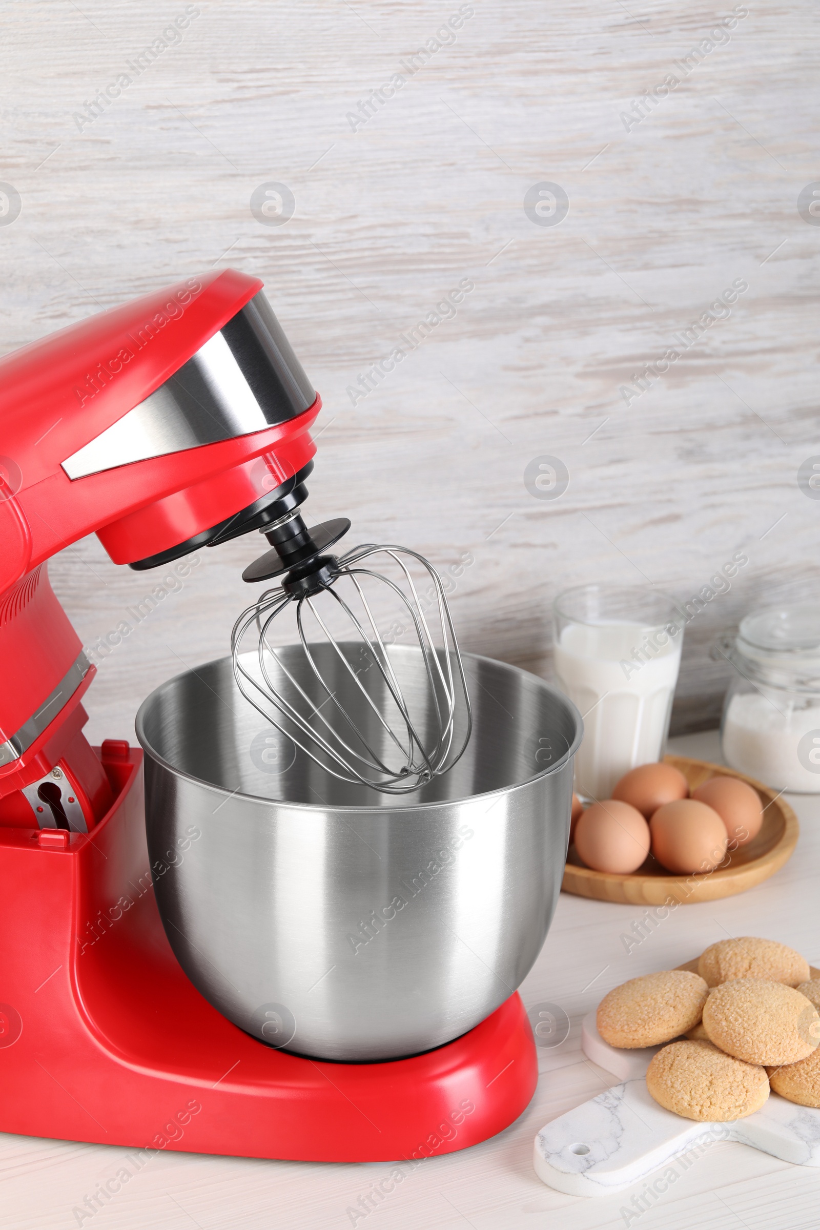 Photo of Composition with modern red stand mixer and different products on white table