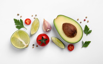 Photo of Fresh ingredients for guacamole on white background, flat lay