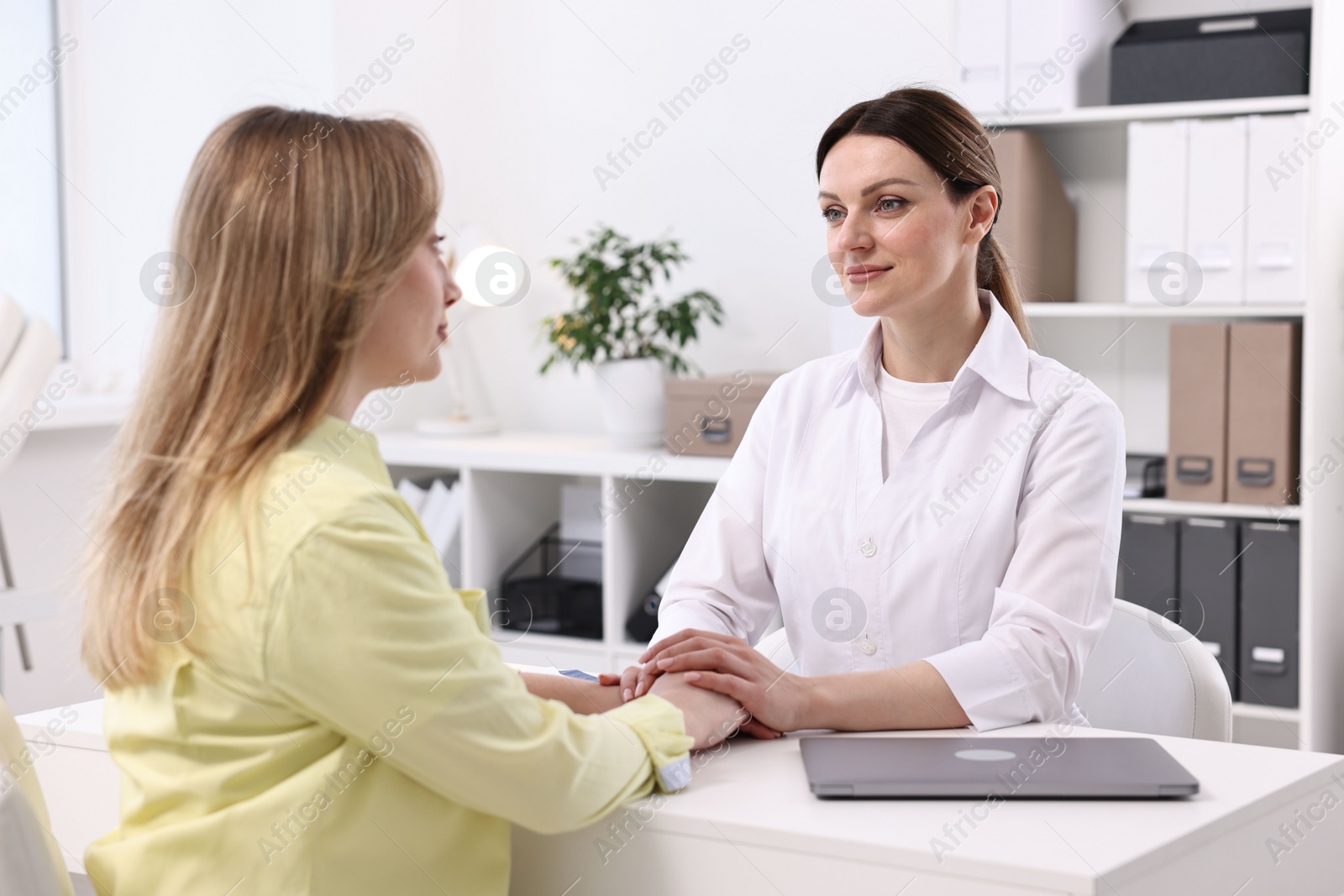 Photo of Mammologist's appointment. Doctor and woman in hospital