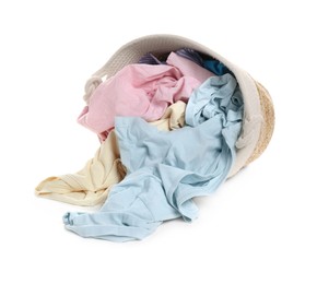 Photo of Overturned laundry basket full of clothes isolated on white