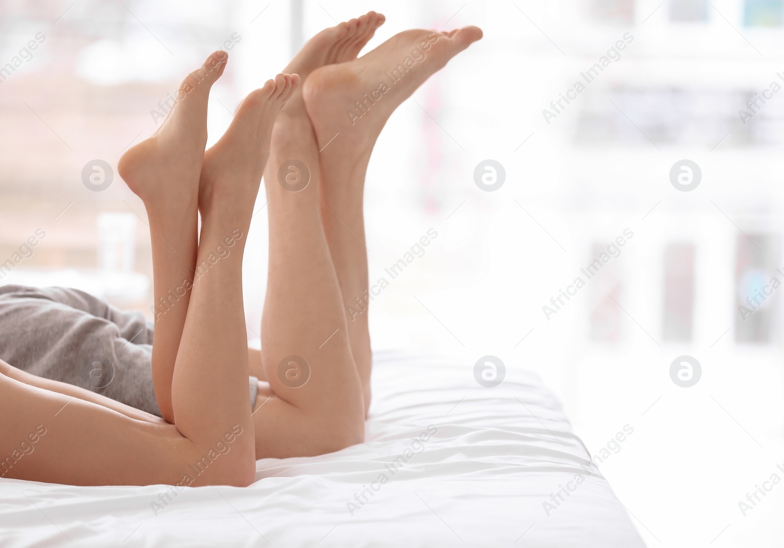 Photo of Young couple in bed at home