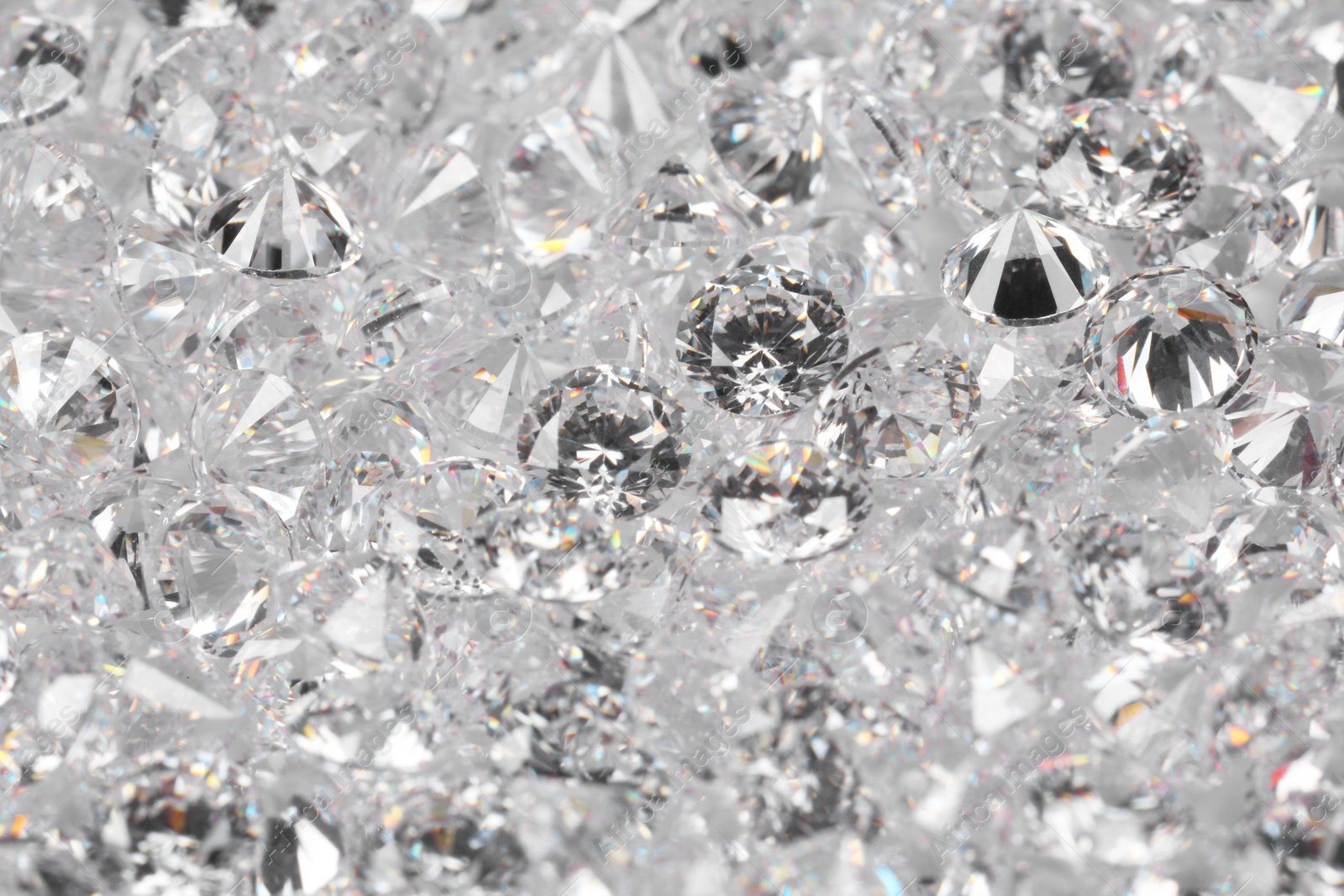 Photo of Many beautiful shiny diamonds as background, closeup