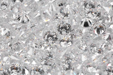 Photo of Many beautiful shiny diamonds as background, closeup