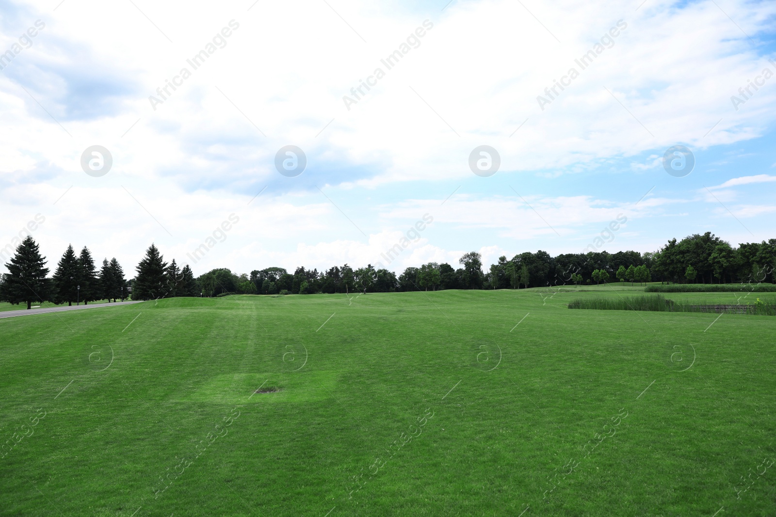 Photo of Beautiful view of golf course with green grass