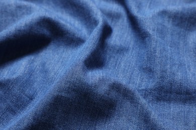 Texture of blue crumpled fabric as background, closeup
