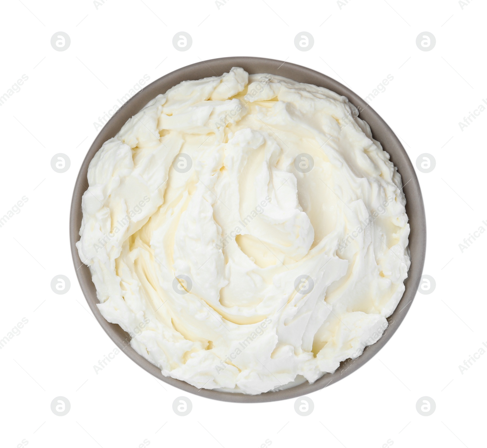 Photo of Bowl of tasty cream cheese isolated on white, top view