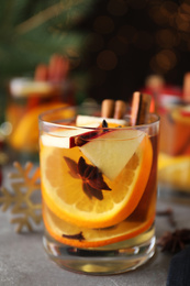 Photo of Aromatic white mulled wine on light grey table