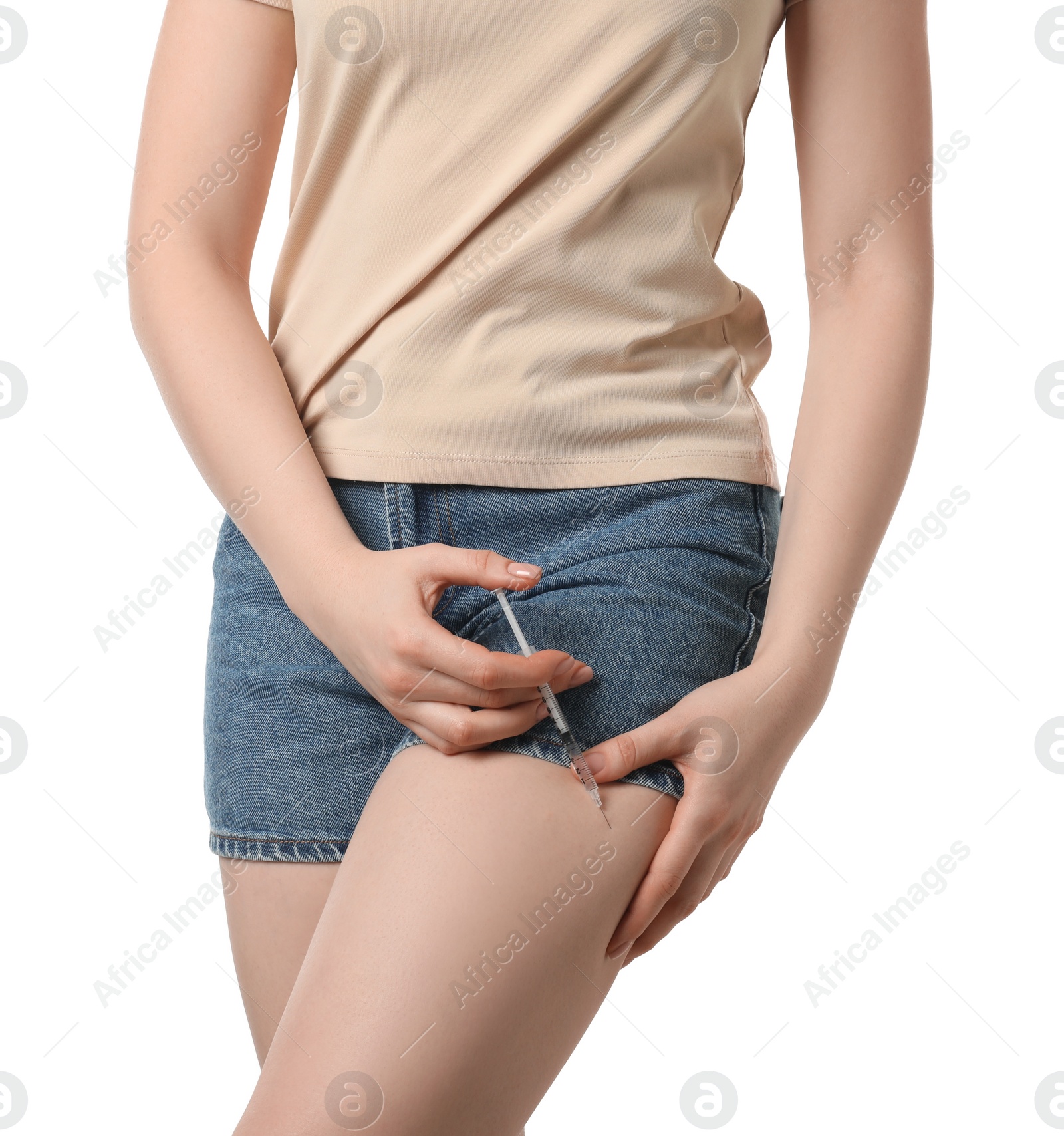 Photo of Diabetes. Woman making insulin injection into her leg on white background, closeup