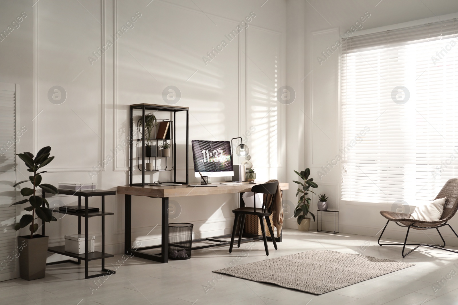 Photo of Room interior with comfortable workplace. Modern computer on wooden desk