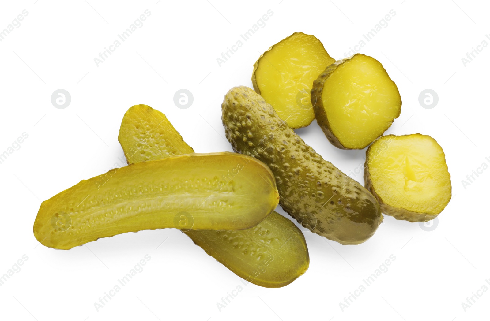 Photo of Tasty sliced and whole pickled cucumbers on white background, top view