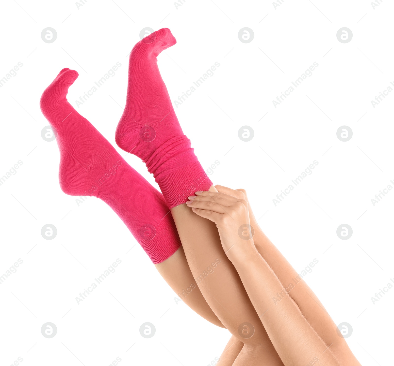 Photo of Woman putting on stylish socks on white background, closeup