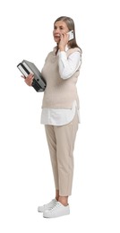 Photo of Senior woman with folders talking on smartphone against white background